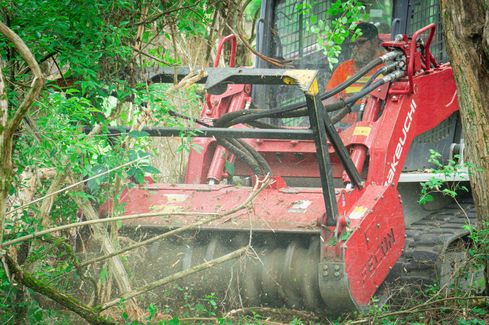 Brushworks forestry mulching equipment processing saplings, vines, and invasive brush in Ohio